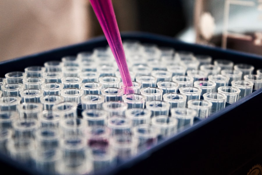 A pipette dispensing into a tray of laboratory microtubes, photographed close